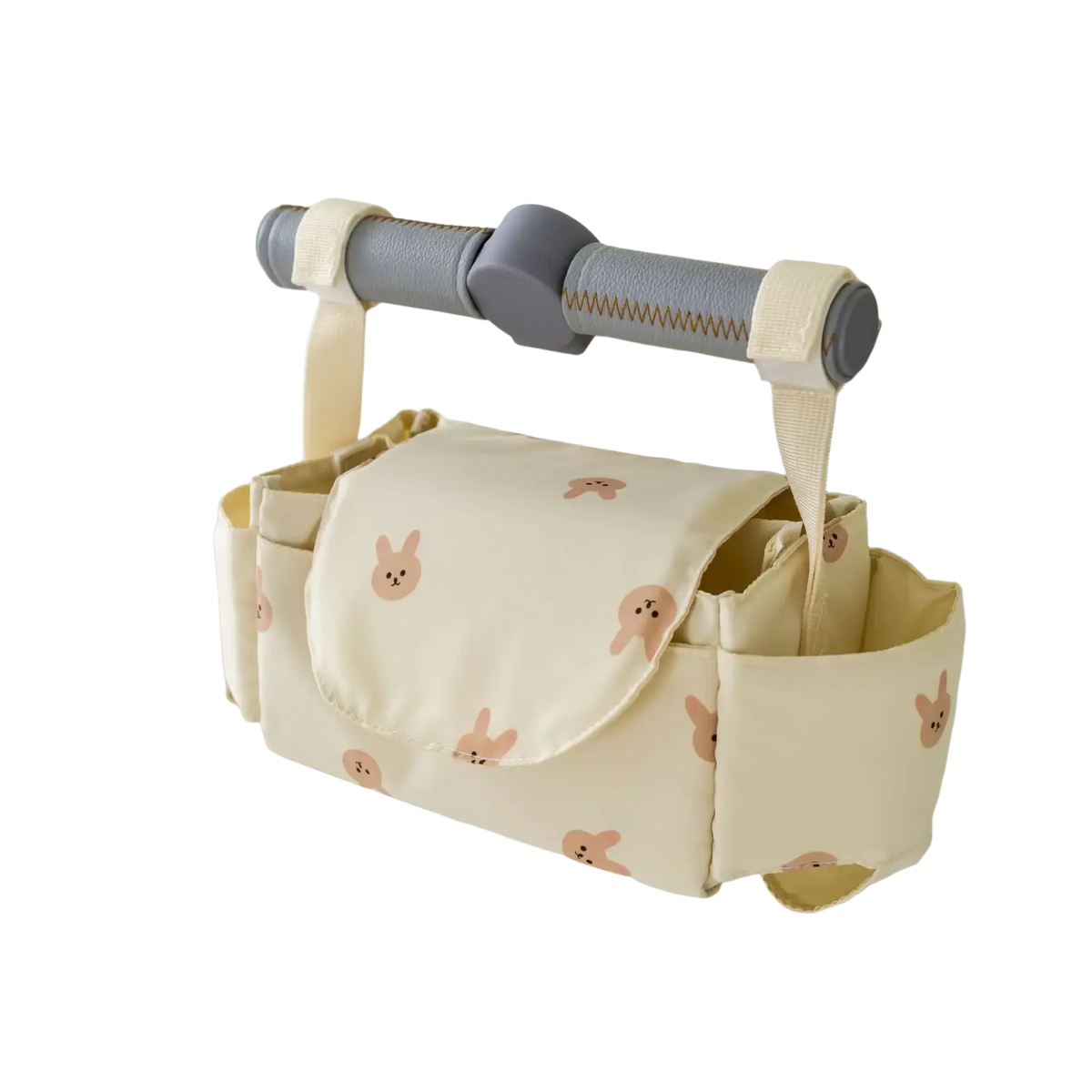 Cream-colored stroller organizer bag with soft plush fabric featuring a cute pattern of small pink bunny faces