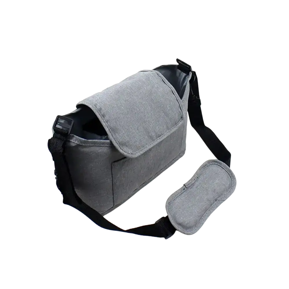 Gray fabric stroller organizer bag with black adjustable strap and matching gray eye mask for pram storage