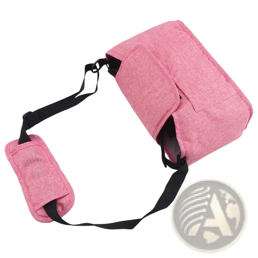 Pink textured fabric stroller organizer bag with black adjustable strap and matching padded handle for pram storage