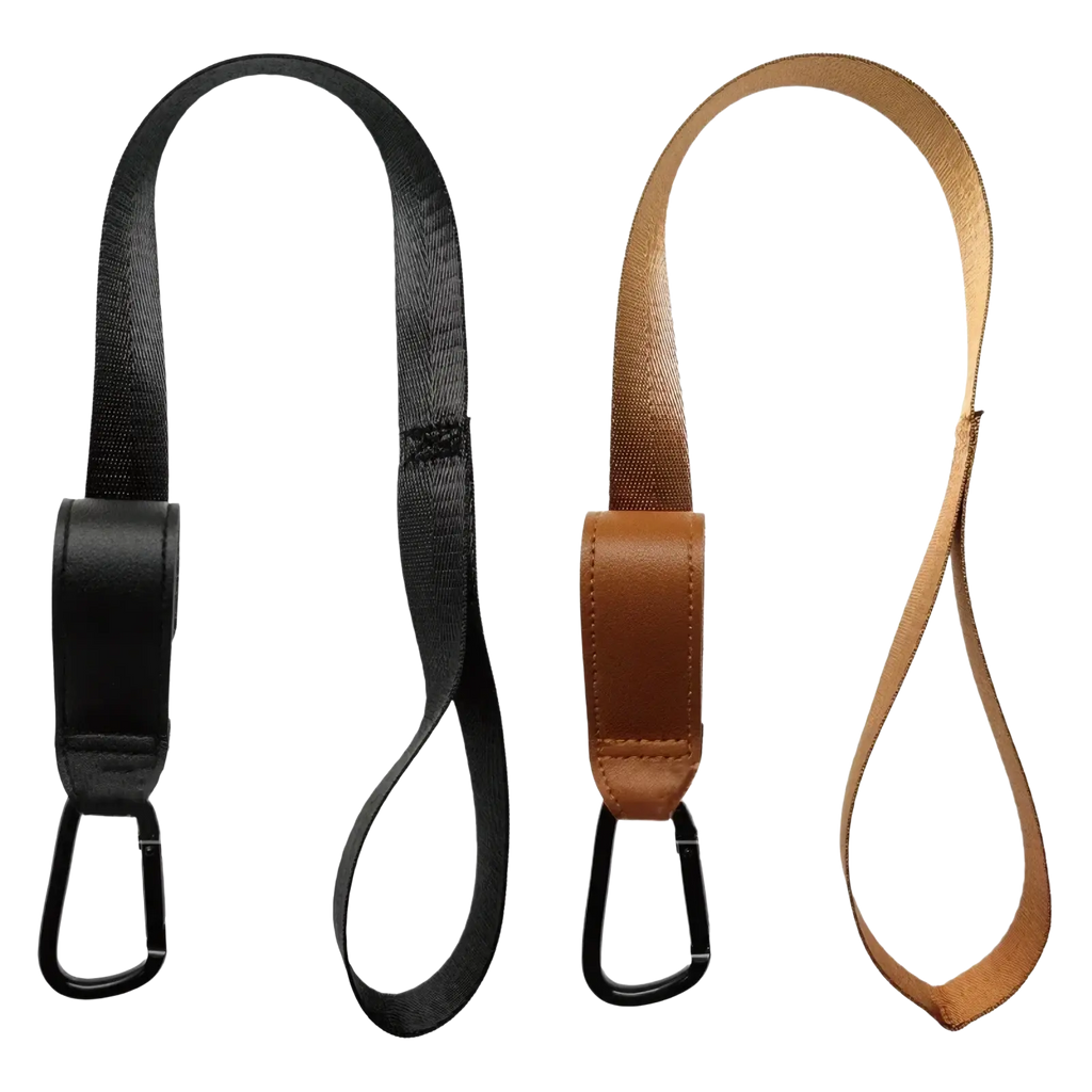 Black and tan stroller safety wrist strap with leather accents and black carabiner clips for anti skid leash use