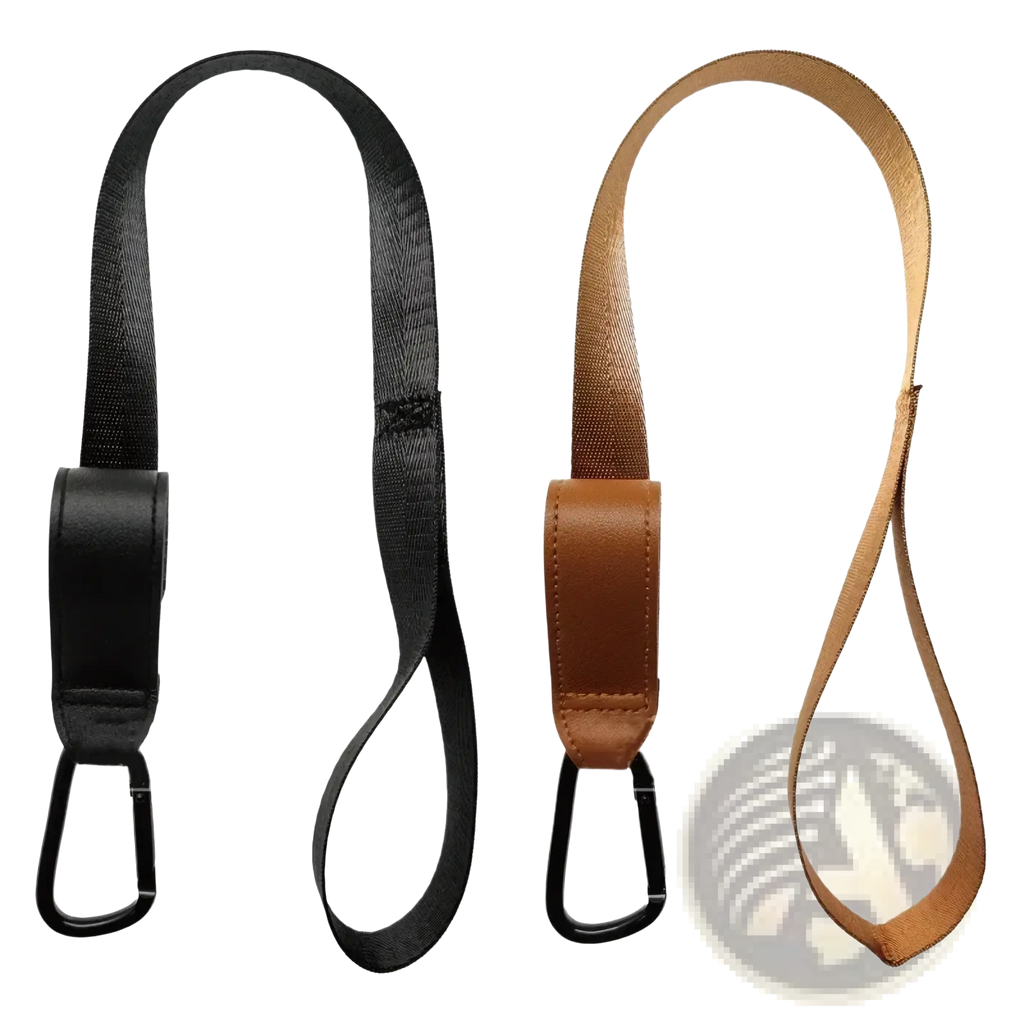 Black and tan stroller safety wrist strap with leather accents and black carabiner clips for anti skid leash use
