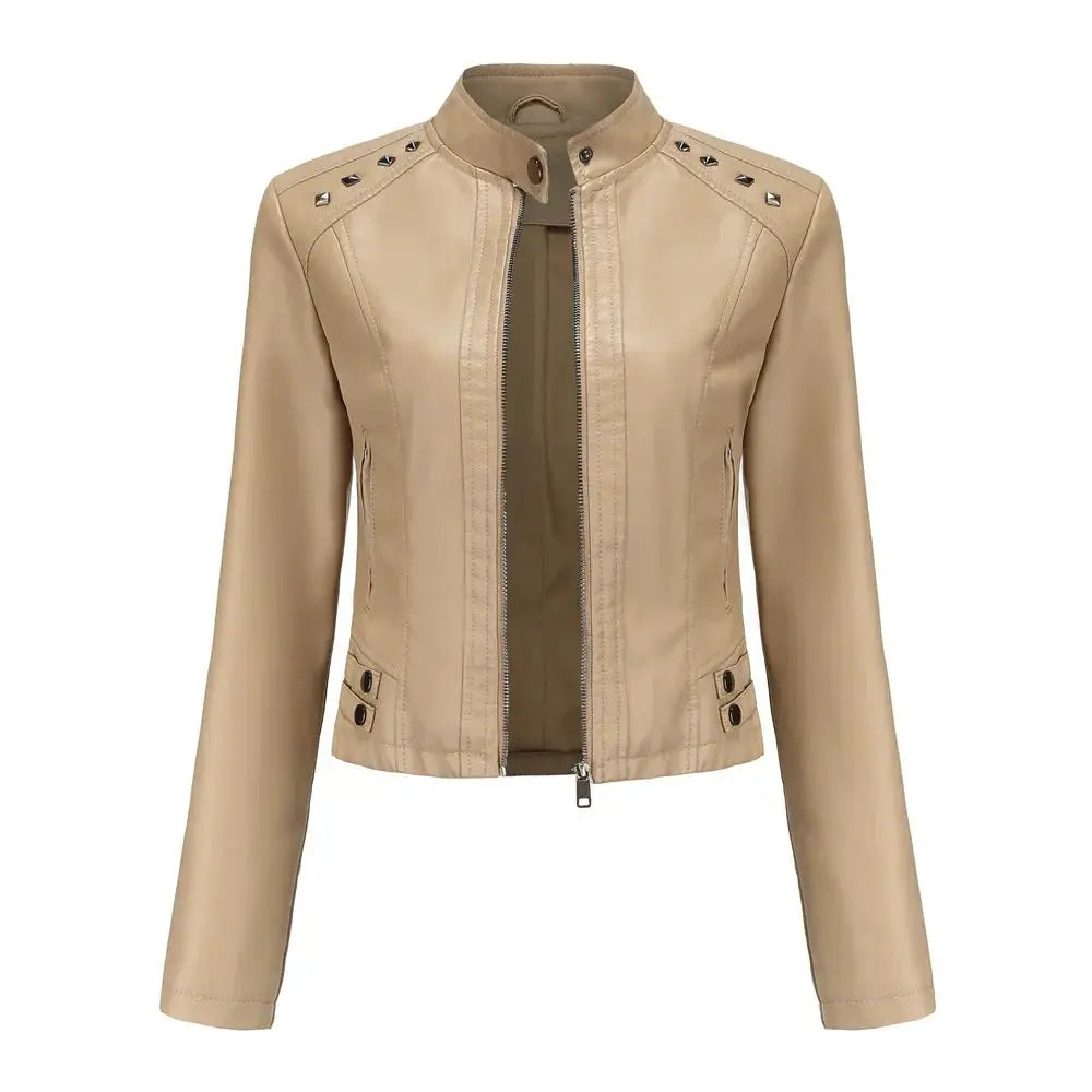 Beige faux leather moto jacket with silver rivets on shoulders and front zipper closure for edgy style
