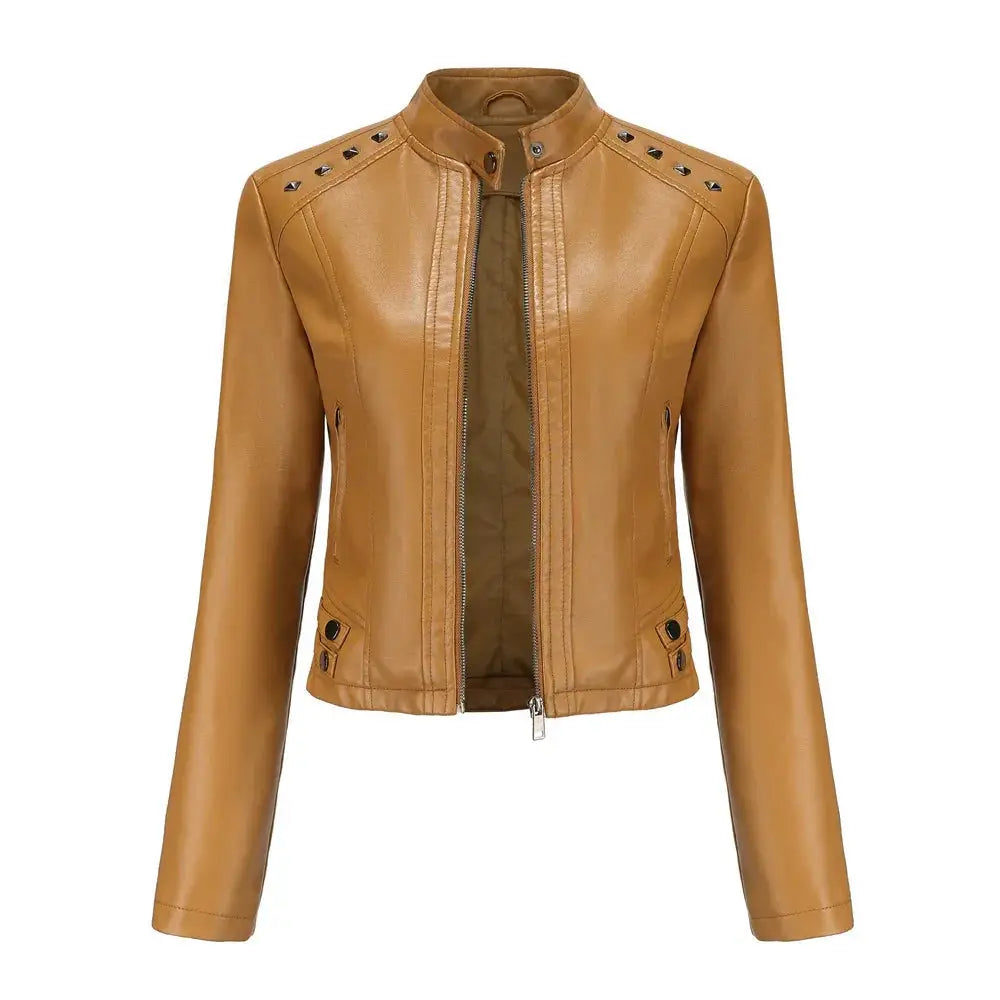Tan faux leather moto jacket with black studs along shoulders and front zipper closure with silver rivets