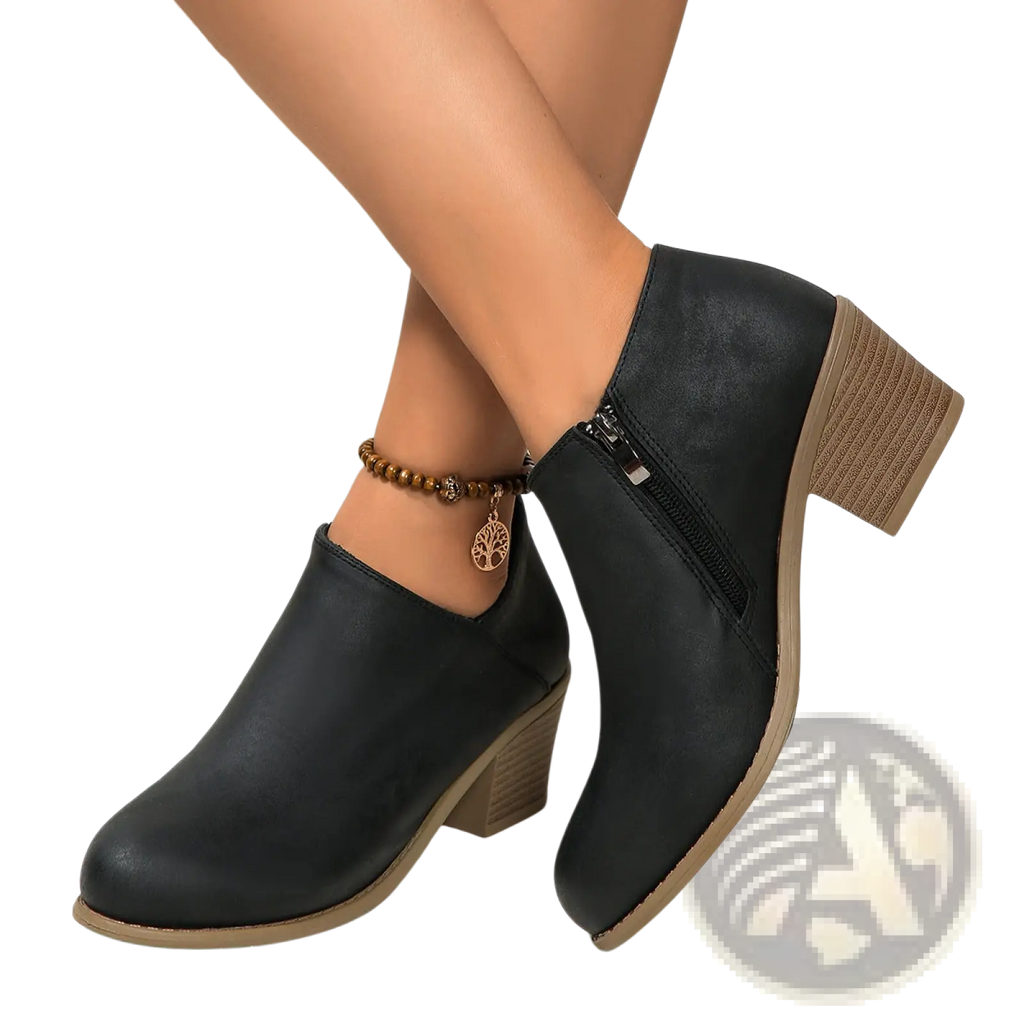 Black leather ankle boot with textured tan block heel and side zipper closure shown from the back side