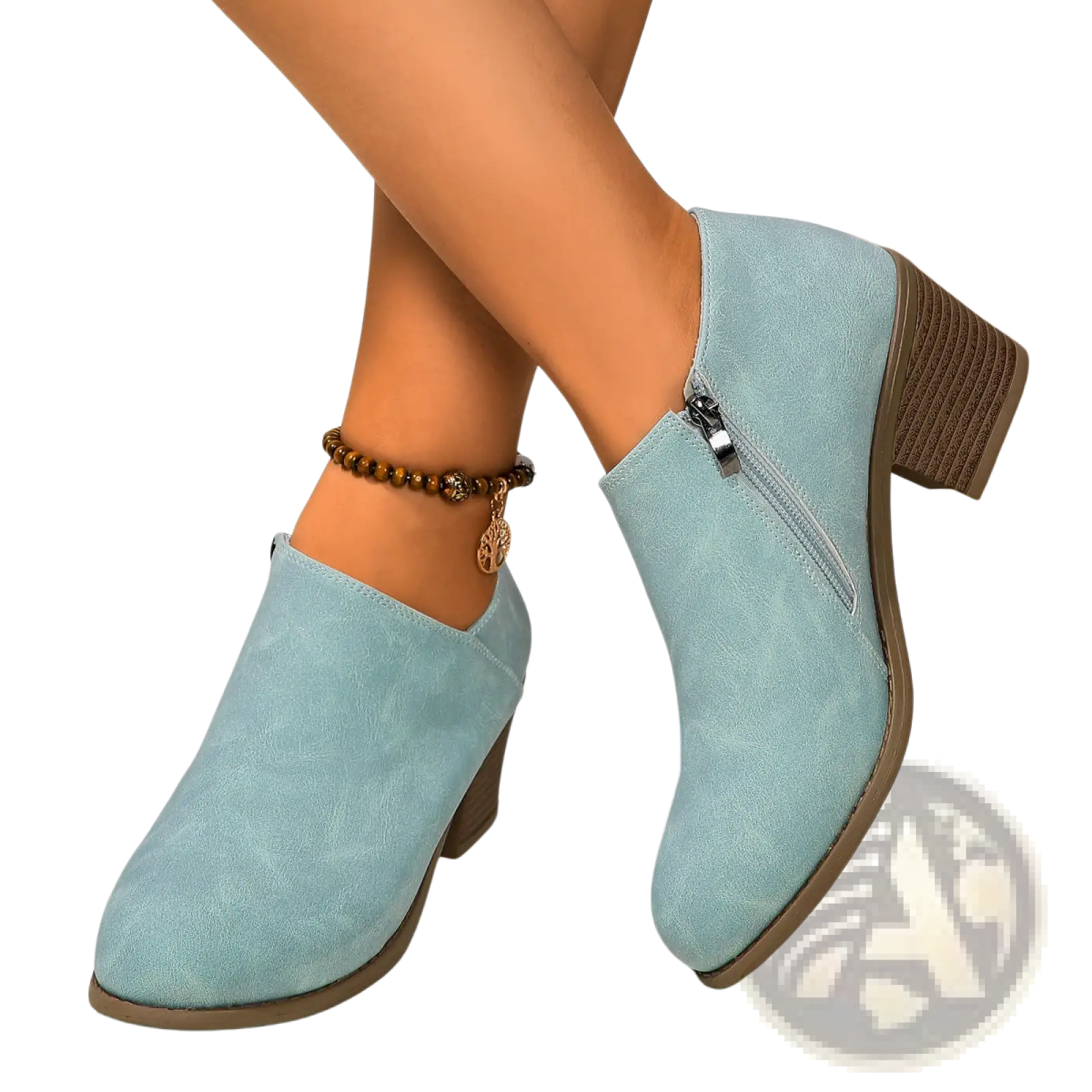 Light blue suede ankle boots with chunky medium block heel and side zipper closure for stylish wear