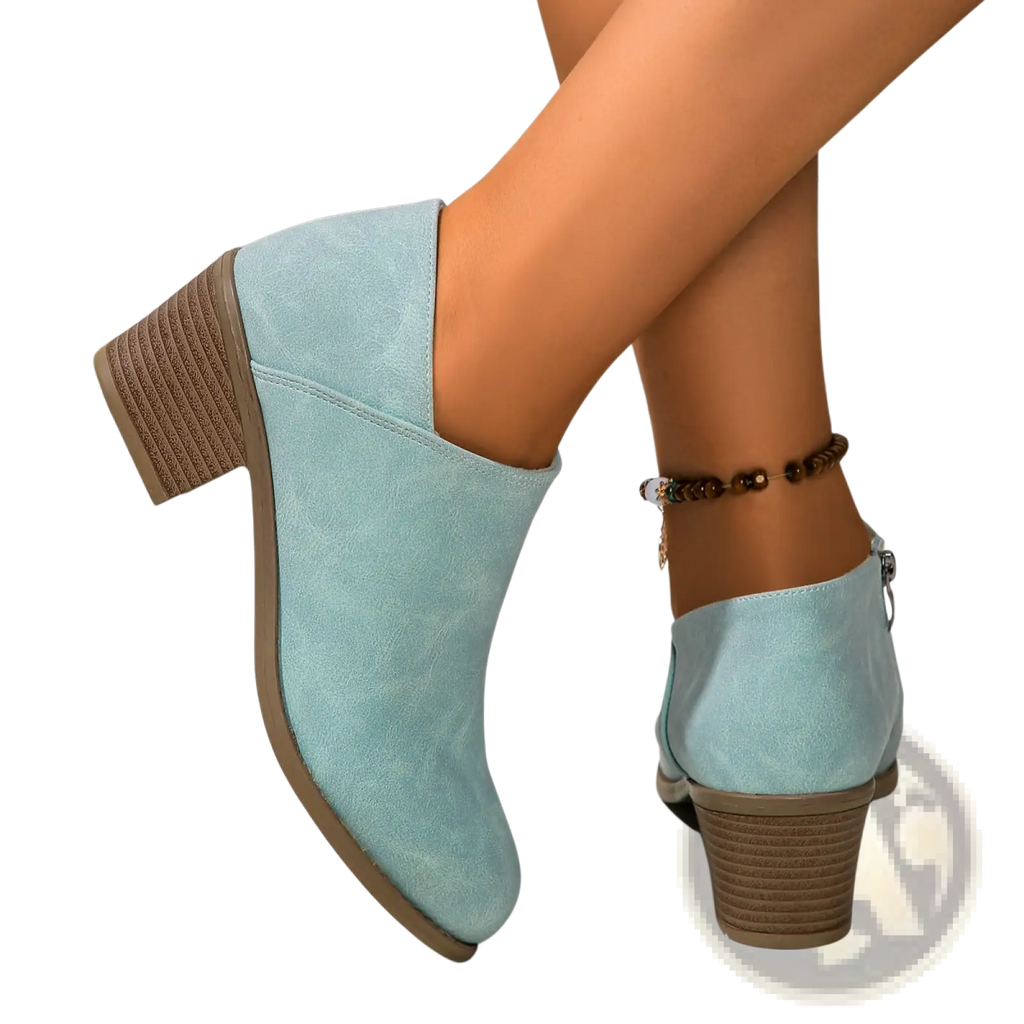 Light blue suede ankle boot with textured brown chunky block heel and side zipper closure for easy wear