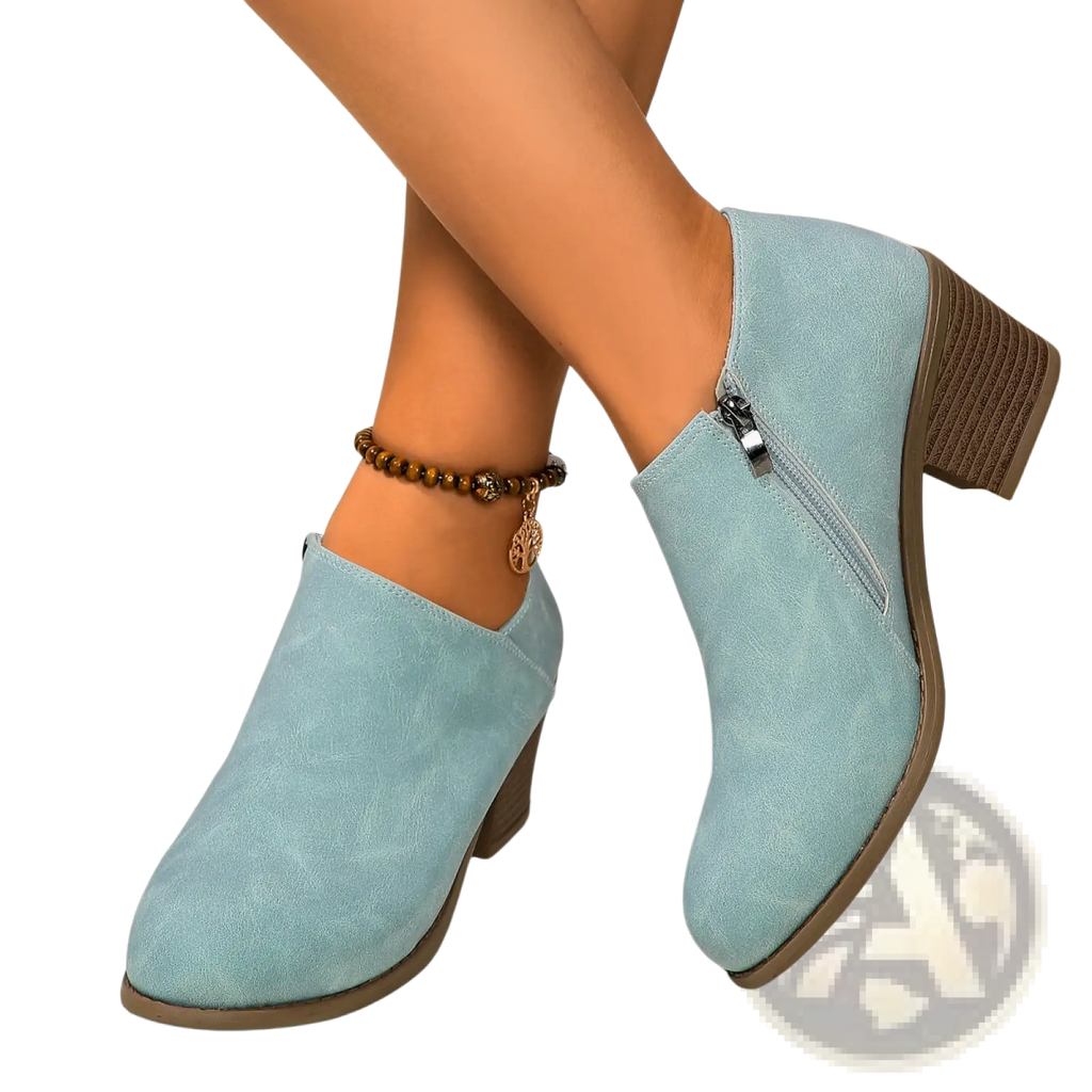 Light blue suede ankle boots with chunky brown heel and side zipper for stylish and comfortable wear