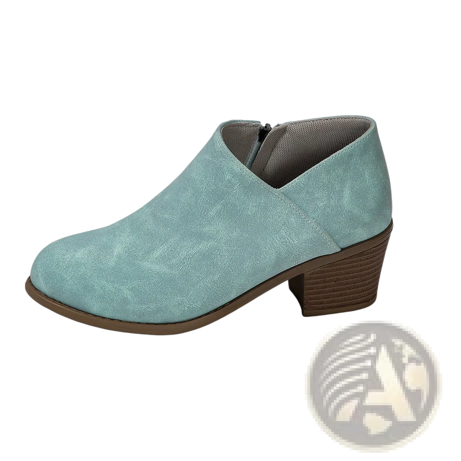 A mint green suede ankle boot with a chunky brown stacked heel and side zipper closure