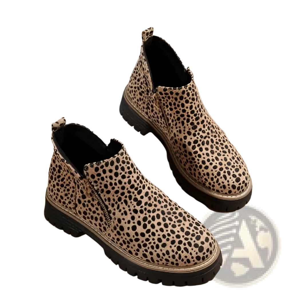 Suede ankle boots with chunky sole in tan and black leopard print featuring a side zipper closure