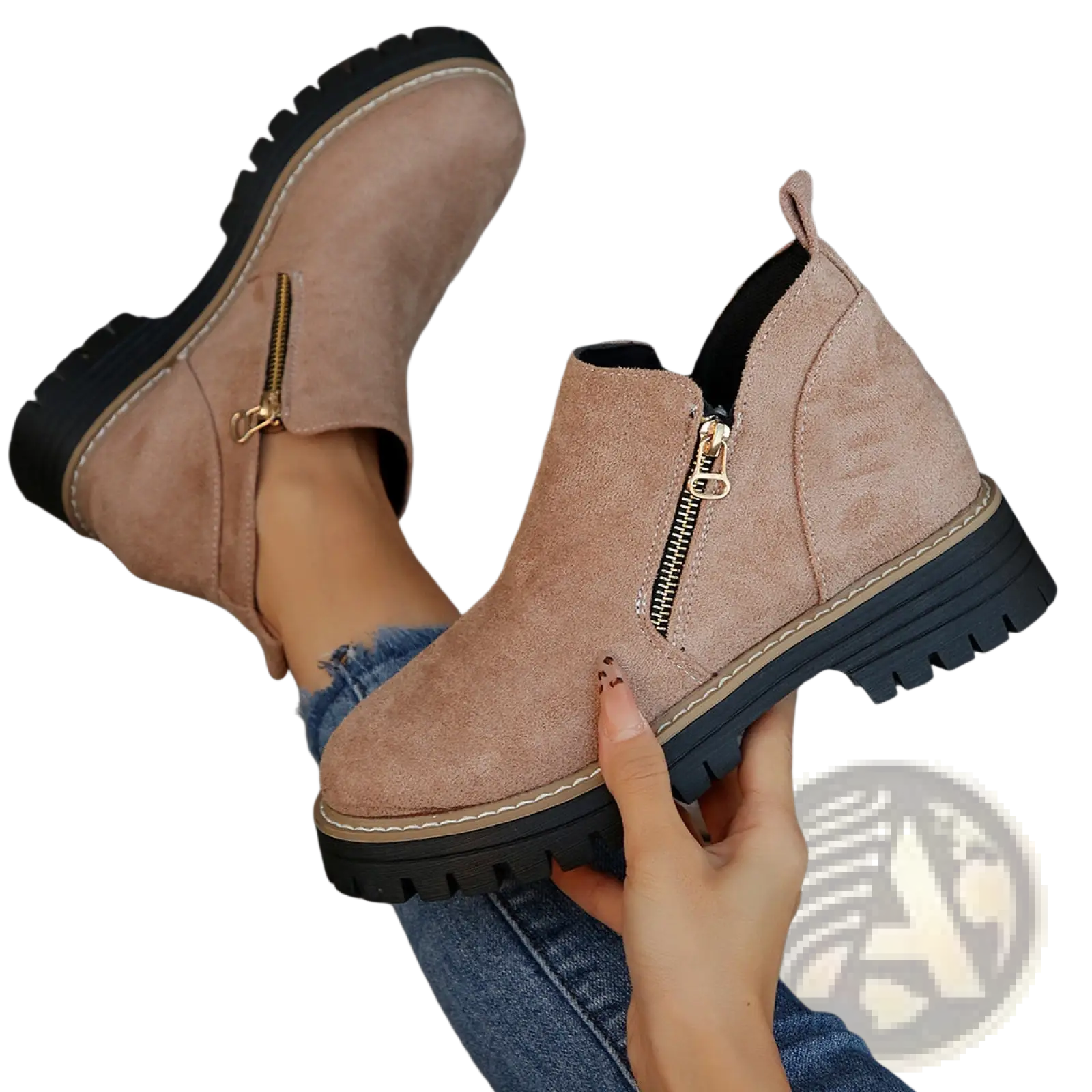 Tan suede ankle boots with black chunky rubber soles and gold side zippers for stylish and durable wear