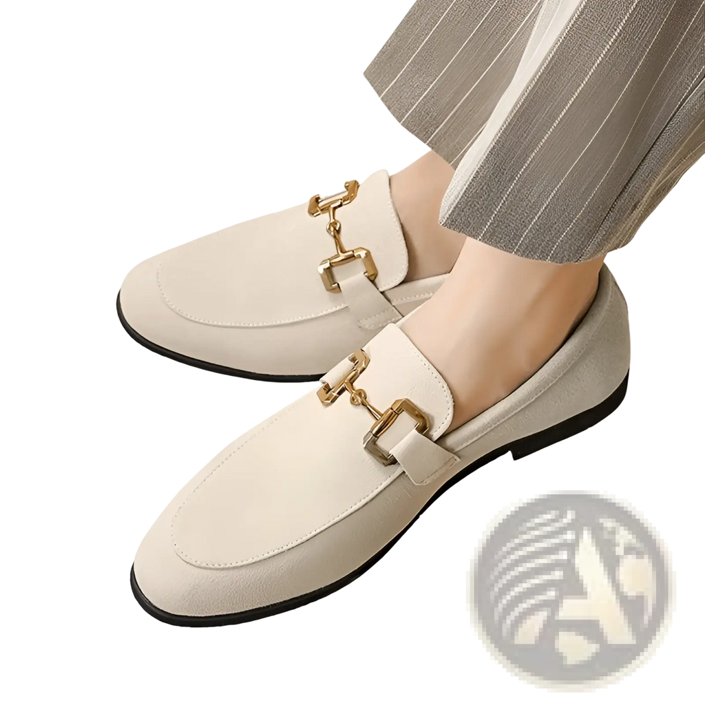 Suede buckle loafers for men in cream with gold-tone horsebit buckles and black soles in cream-colored suede