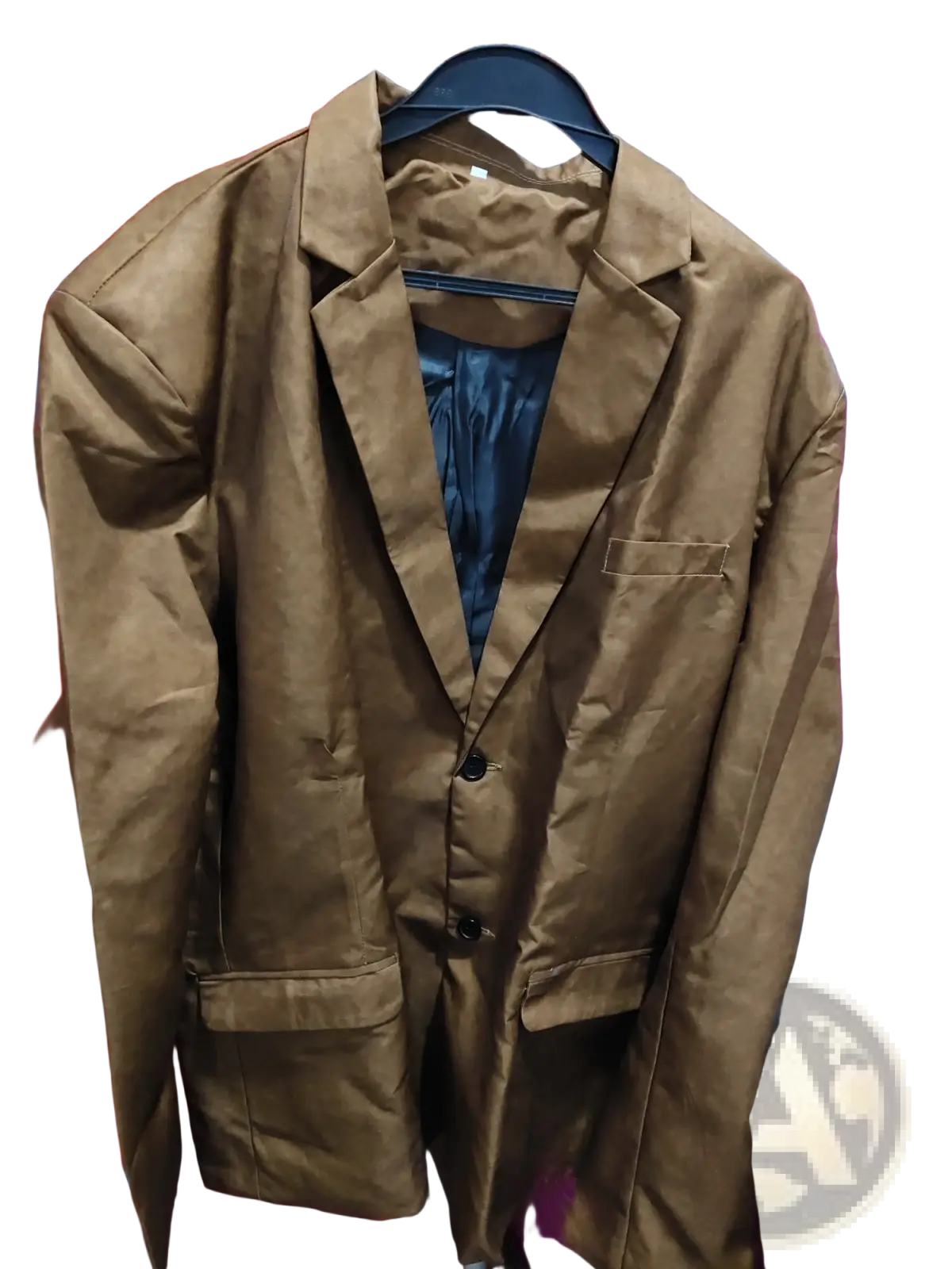 Brown suede double button blazer jacket with matte finish and black buttons hanging on a hanger
