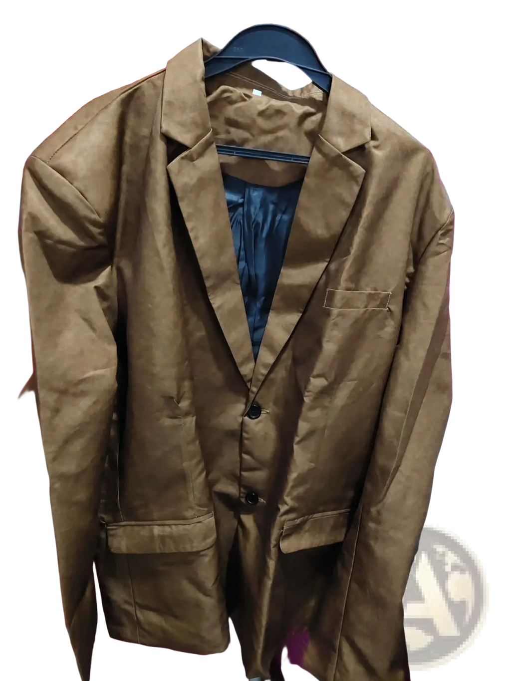 Brown suede double button blazer jacket with matte finish and black buttons hanging on a hanger
