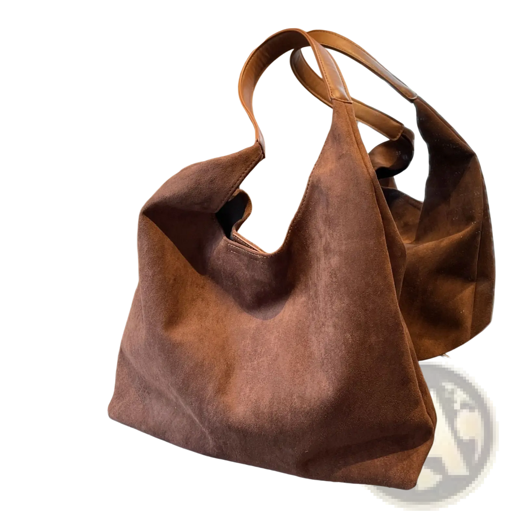 A brown suede shoulder bag large capacity slouchy tote bag with soft design and matching leather handles