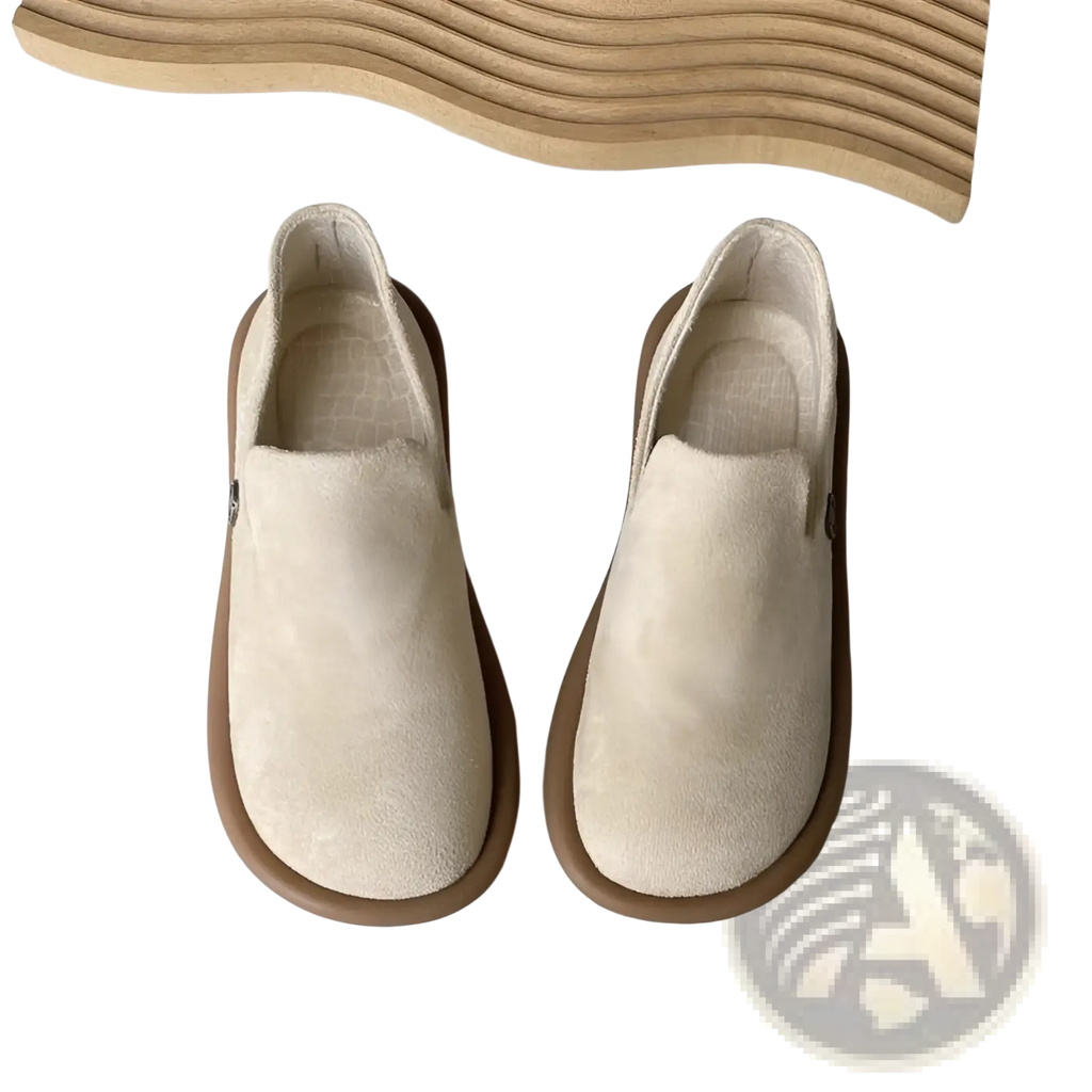 Cream-colored suede slip-on vintage British style low heel pumps with brown rubber sole for casual wear