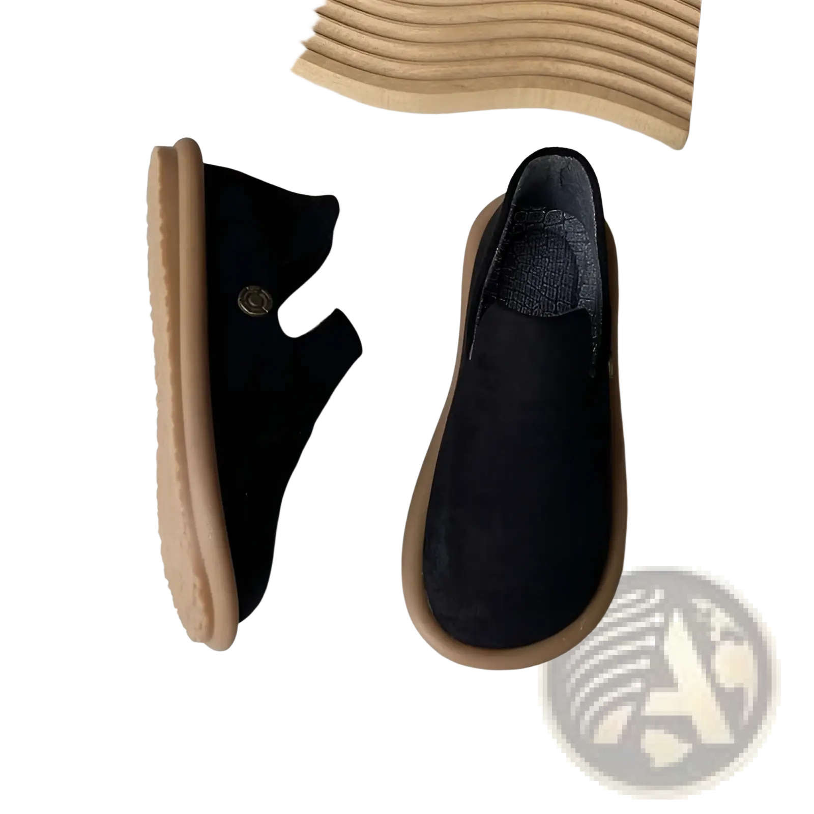 Black suede slip on vintage British style low heel pumps with tan rubber soles and a small metallic button on the side