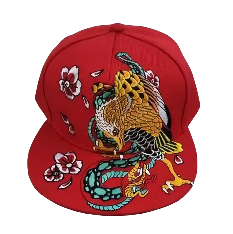 Red embroidered Sugar Skull Rivet snapback baseball cap featuring a golden eagle and teal snake with pink floral accents