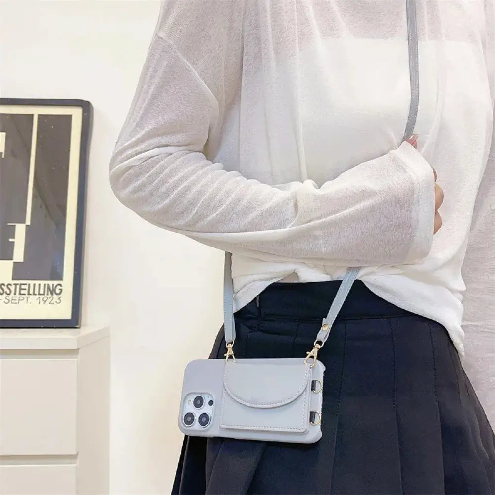 Light gray litchi leather card holder phone case with front pocket and adjustable lanyard for hands free use