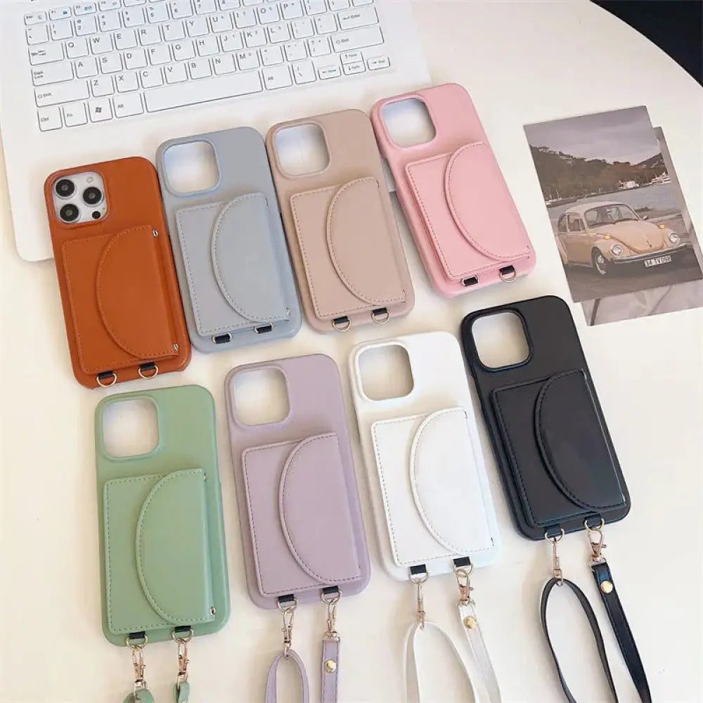 A collection of pastel and neutral litchi leather card holder phone cases with lanyards and attached card slots