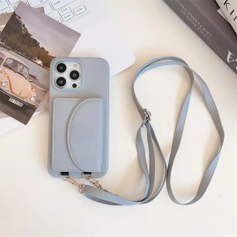 Light blue silicone litchi leather card holder phone case with matching strap and card pocket shown from the back side