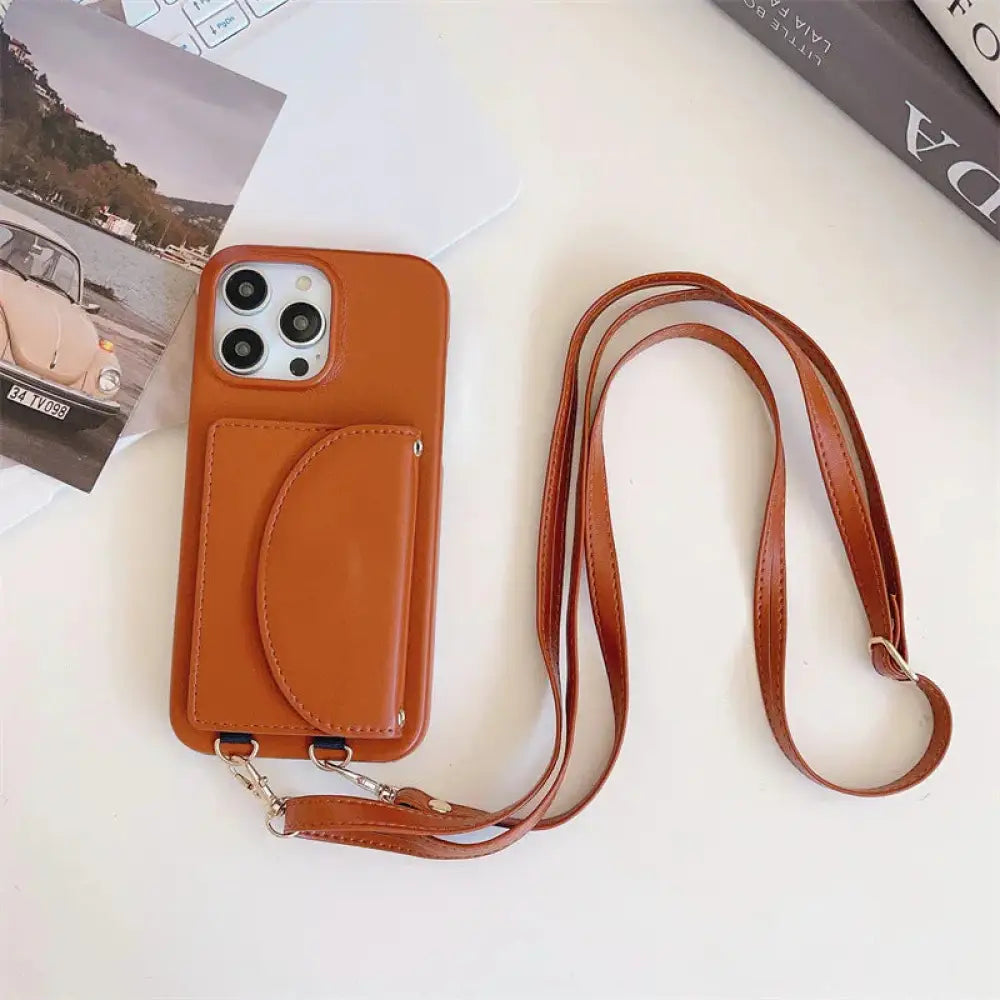 Tan litchi leather card holder phone case with attached strap and card pocket shown from the back side
