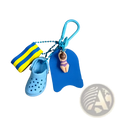 Blue miniature croc summer beach clog keychain with striped swim sock and buoy keychain featuring a woman figurine
