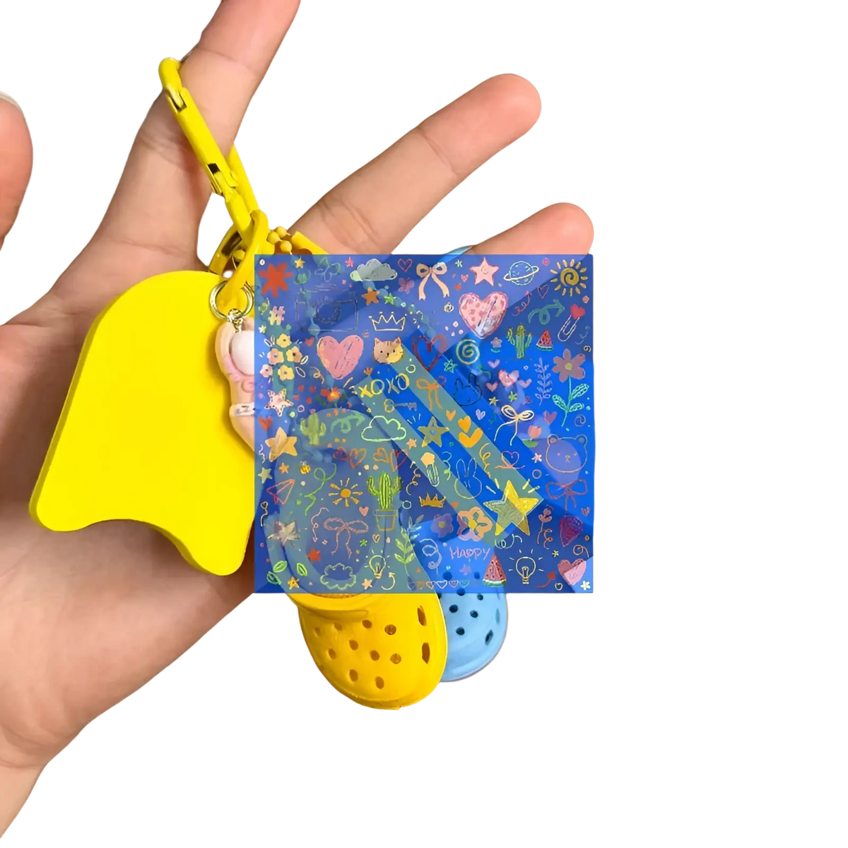 Blue transparent summer beach clog keychain bag charm with colorful cartoon illustrations and yellow carabiner clip