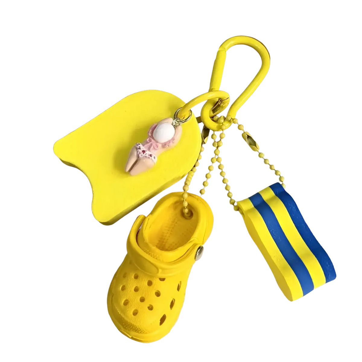 Bright yellow miniature croc summer beach clog keychain bag charm with swim float and striped towel attached