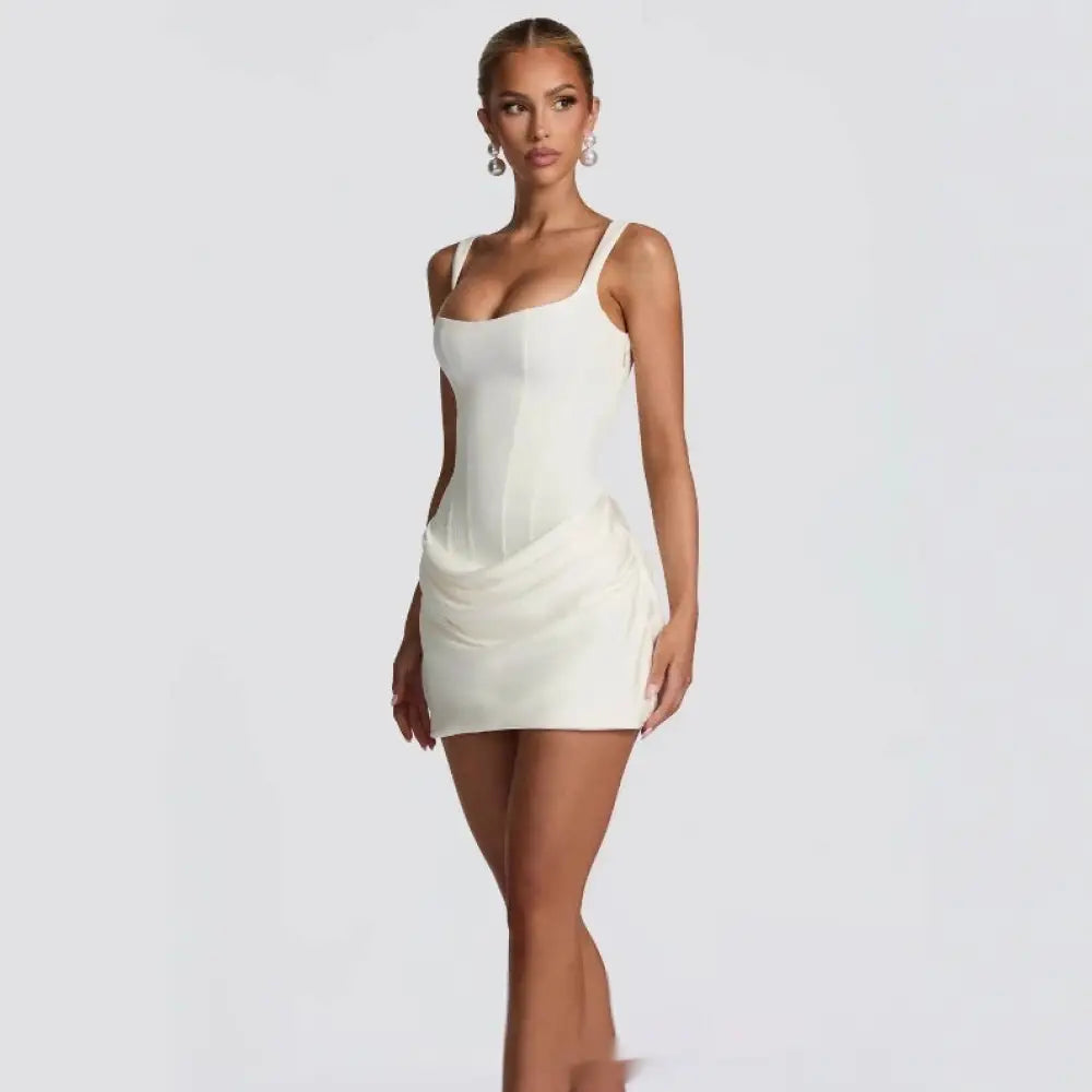 A sleek off-white satin ruched corset sleeveless mini party dress with thin spaghetti straps and draped front detail