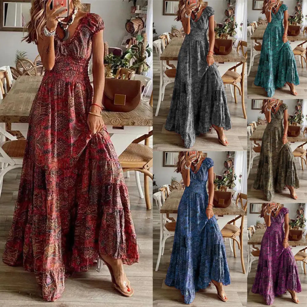 A flowing earthy red floral paisley v neck tiered maxi dress with short sleeves made of lightweight fabric