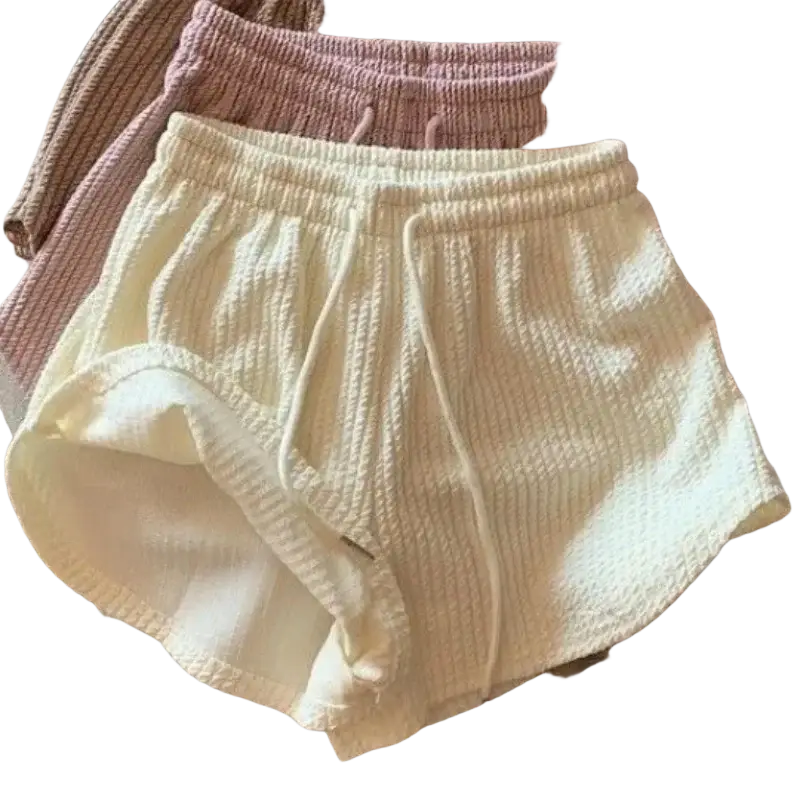 Cream-colored ribbed knit summer shorts with a drawstring waistband ideal for waffle sport fitness and short pants use