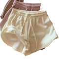 Cream-colored ribbed knit summer shorts with a drawstring waistband ideal for waffle sport fitness and short pants use