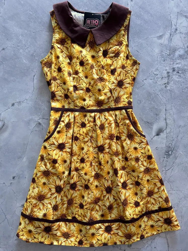 Retro sunflower cotton sleeveless dress in yellow with a brown velvet collar and matching trim with pockets