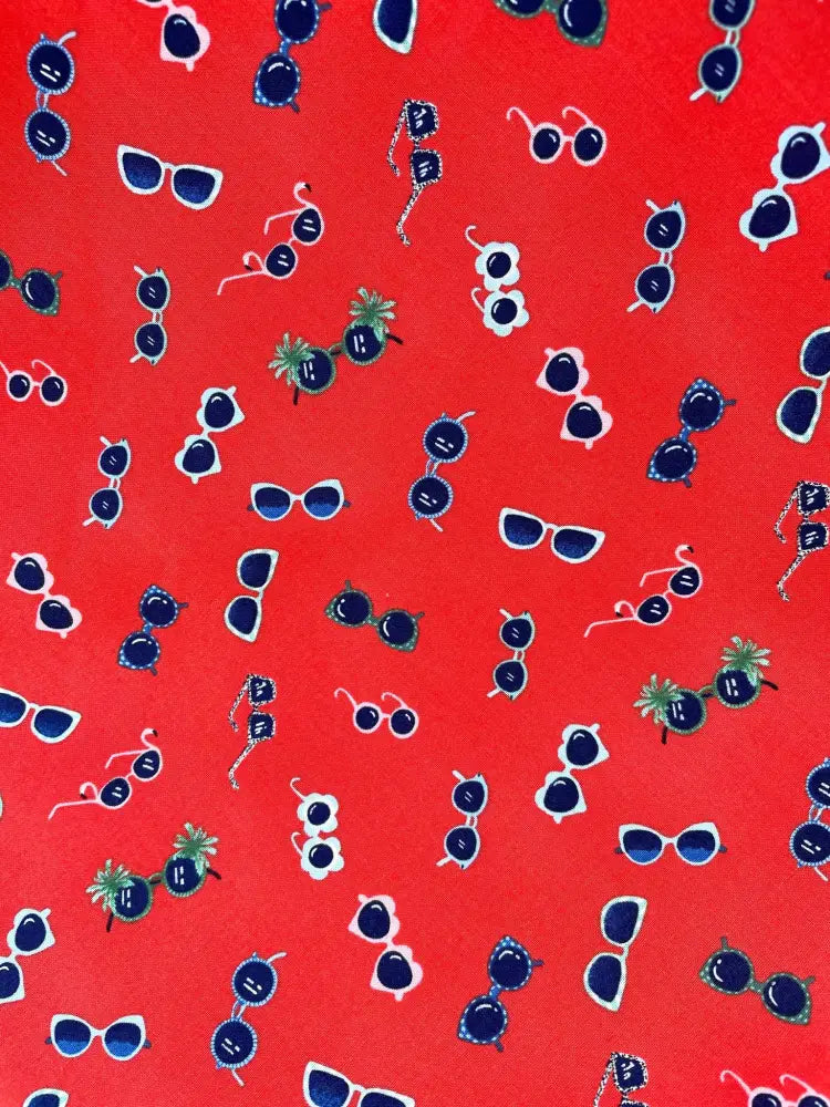 Vintage red floral sunglasses print cotton a line dress featuring vibrant red fabric with navy blue white sunglasses and pineapple accents