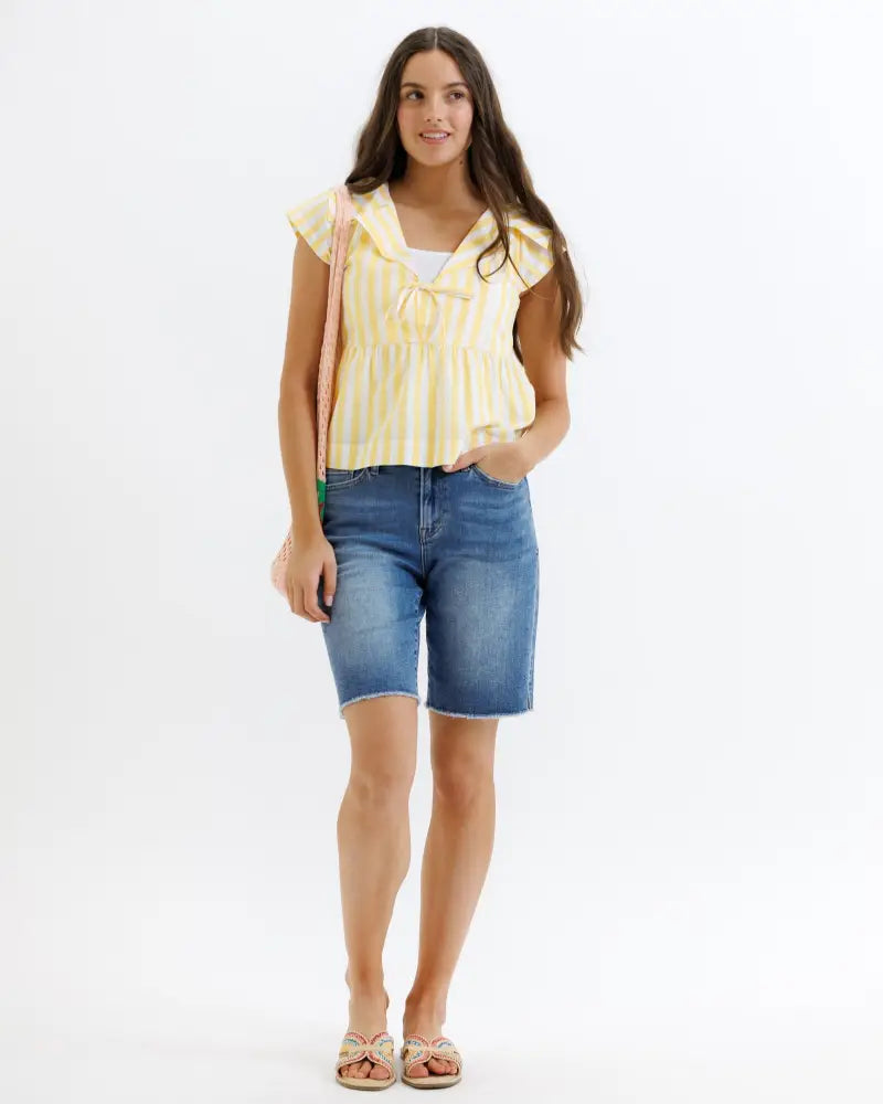 Sunshine stripe cotton peplum ruffle blouse with yellow and white stripes and tie-front neckline in cotton fabric