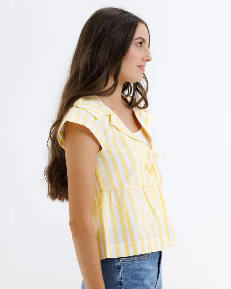 Yellow and white vertically striped cotton short-sleeved blouse with ruffled collar and gathered waist peplum design