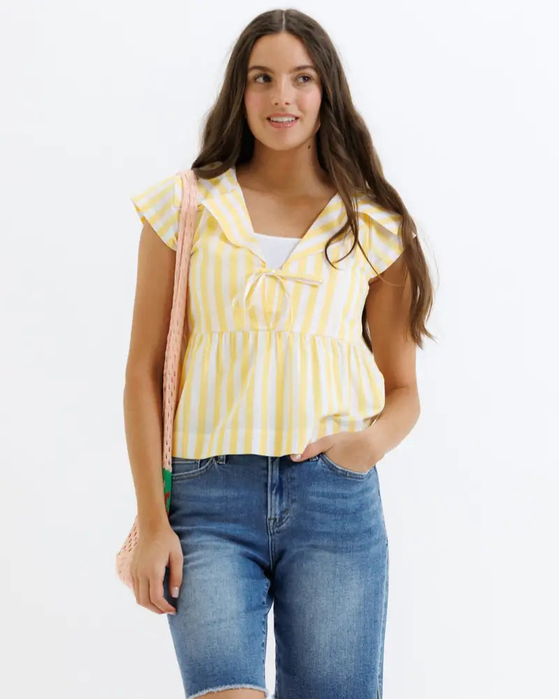 Yellow and white striped cotton peplum ruffle blouse with a tie-front neckline for casual wear