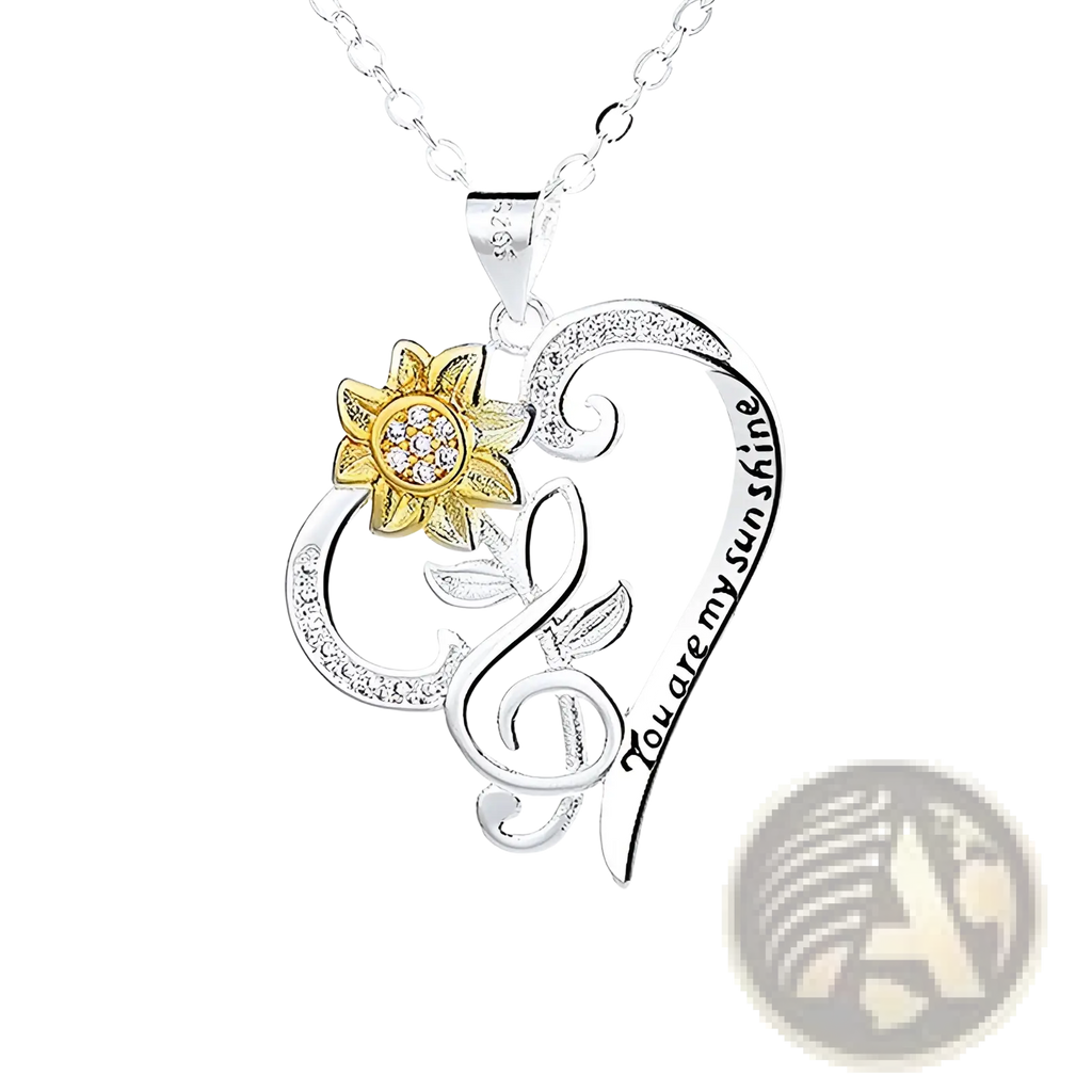 Silver heart-shaped pendant necklace with gold sunflower, clear gemstones, and engraved you are my sunshine text