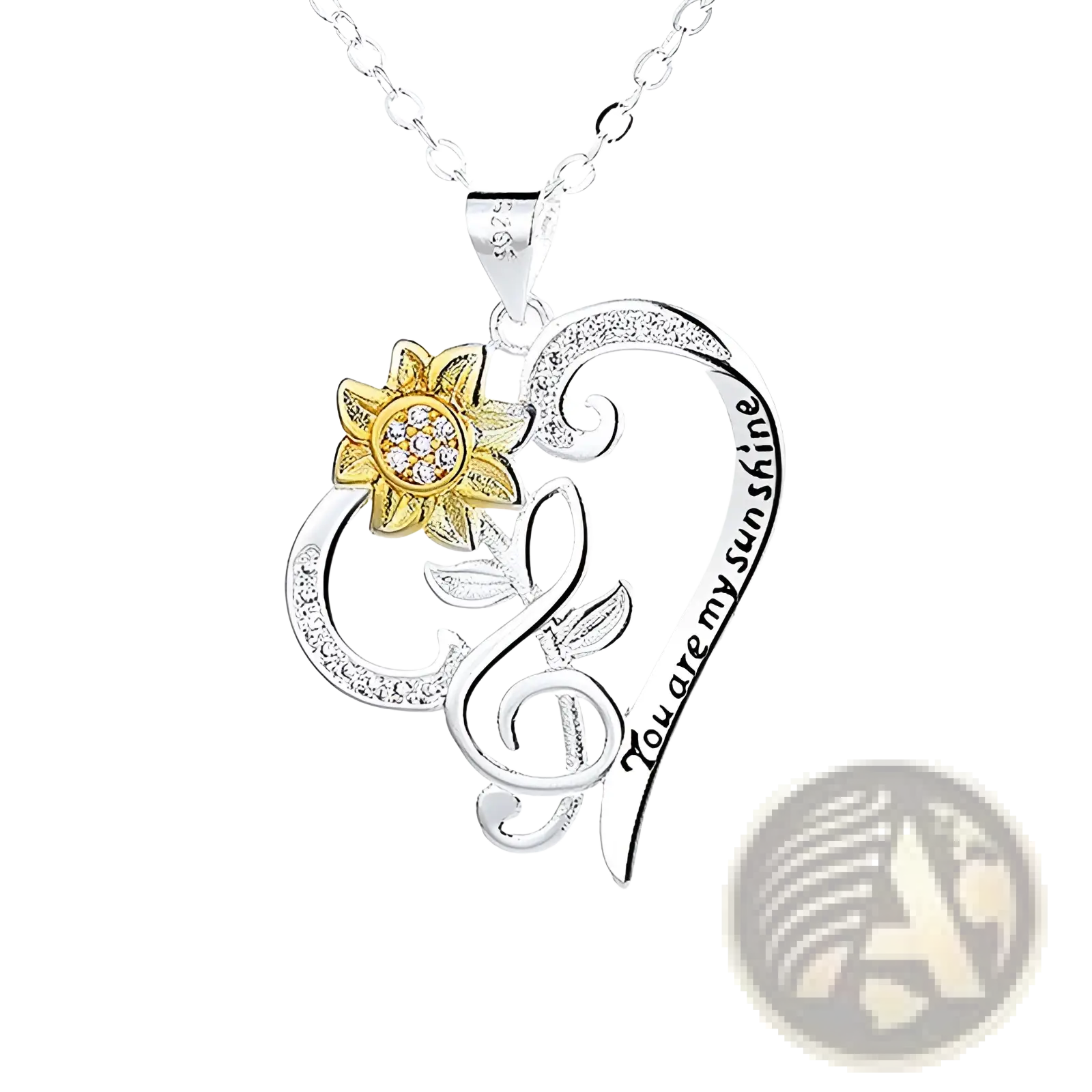 Silver heart-shaped pendant necklace with gold sunflower, clear gemstones, and engraved you are my sunshine text