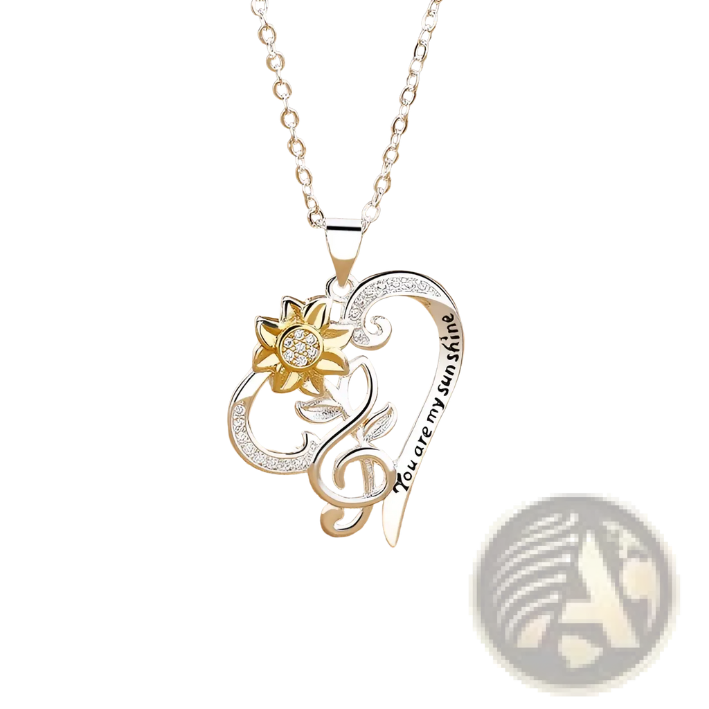 Silver heart-shaped pendant necklace with gold sunflower charm and crystals inscribed you are my sunshine