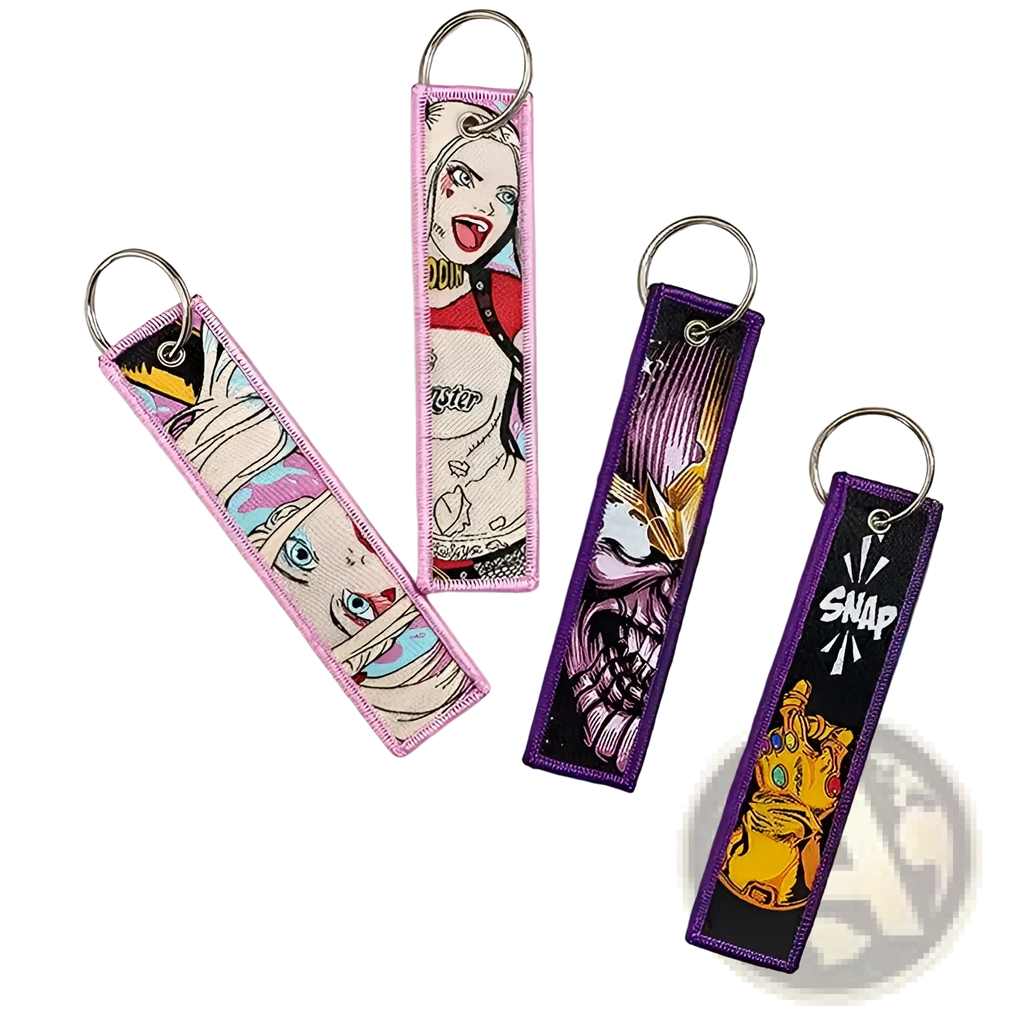 Pink and purple embroidered superhero keychain set featuring comic book character designs for anime key lanyards