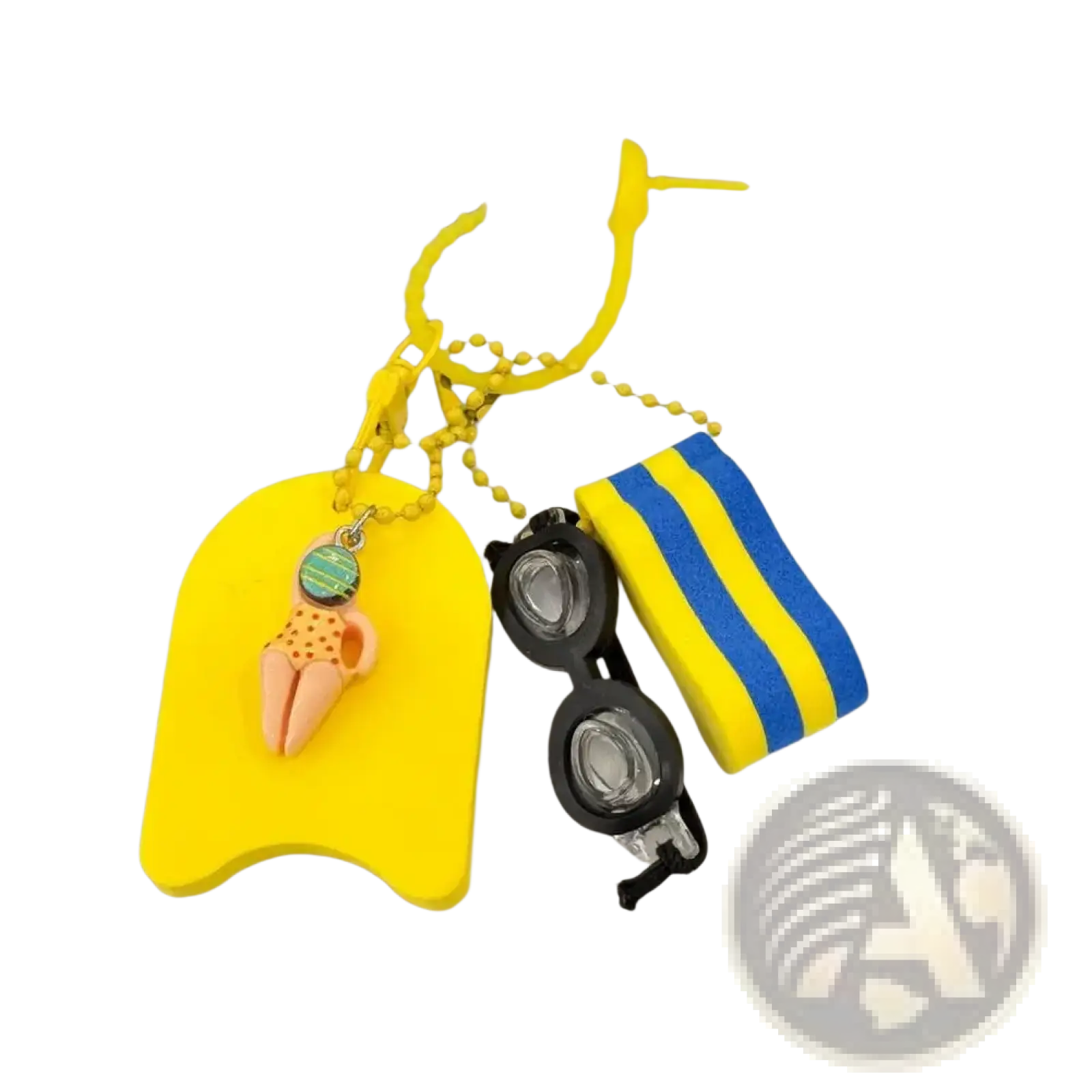 Bright yellow foam swim float keychain with small orange figurine in swimwear hanging from tote bag charm