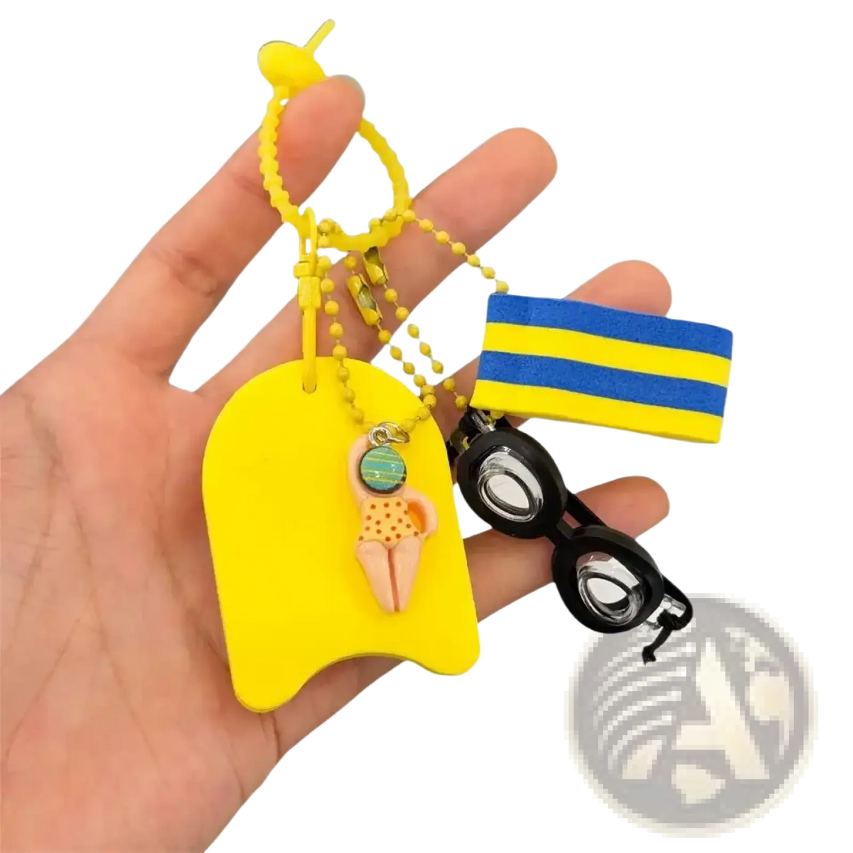 Yellow swim float keychain with orange polka-dot swimsuit figurine and blue-yellow striped band on yellow beads