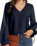 Black Swiss dot chiffon blouse with v neck and sheer textured long sleeves featuring pom-poms and ruffled cuffs