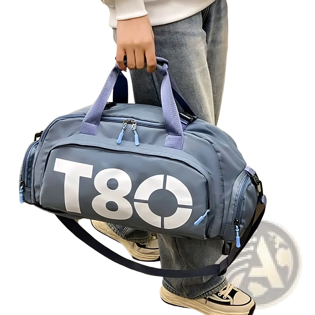 T80 gym duffel bag in gray with light blue zippers handles bold white logo and shoe compartment for gym use