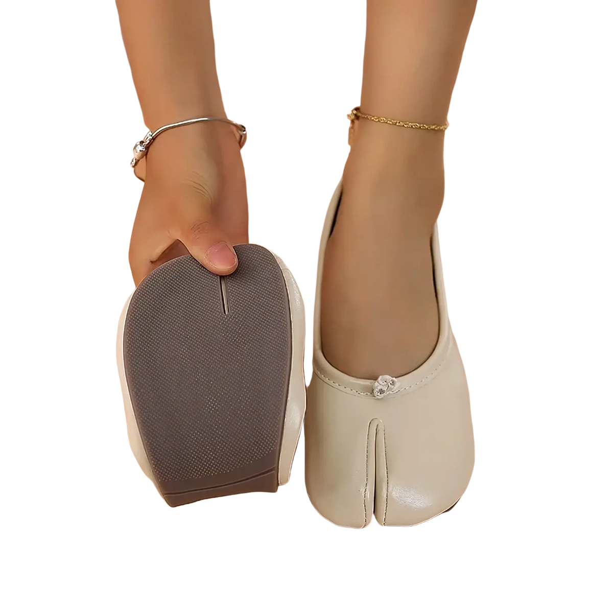 Cream-colored leather tabi flat shoes featuring a small decorative button on the toe for stylish comfort