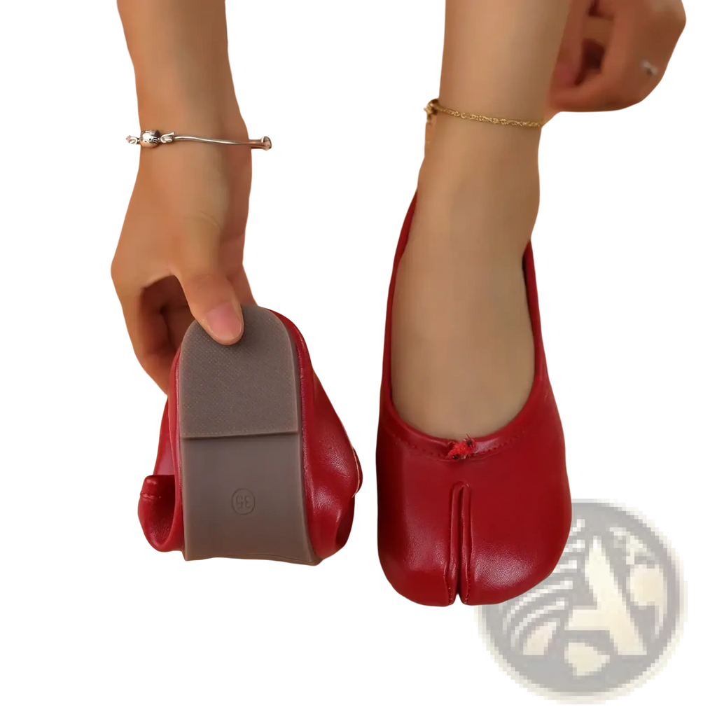 Red leather tabi leather flat shoes with gray rubber sole and small red bow detail on the front