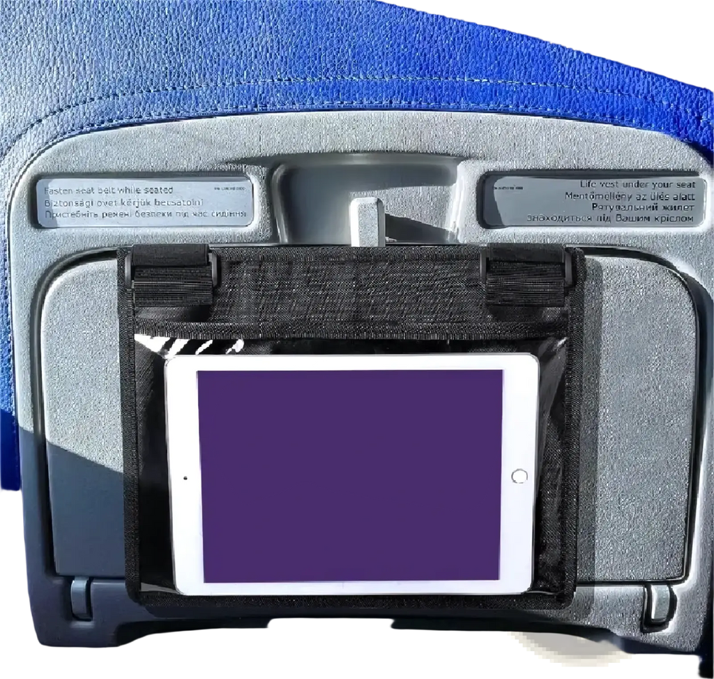Black fabric tablet holder securely gripping a white iPad on an airplane seat for travel convenience