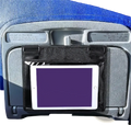 Black fabric tablet holder securely gripping a white iPad on an airplane seat for travel convenience