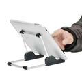 Silver and black foldable aluminum universal tablet holder stand holding a white iPad in adjustable position